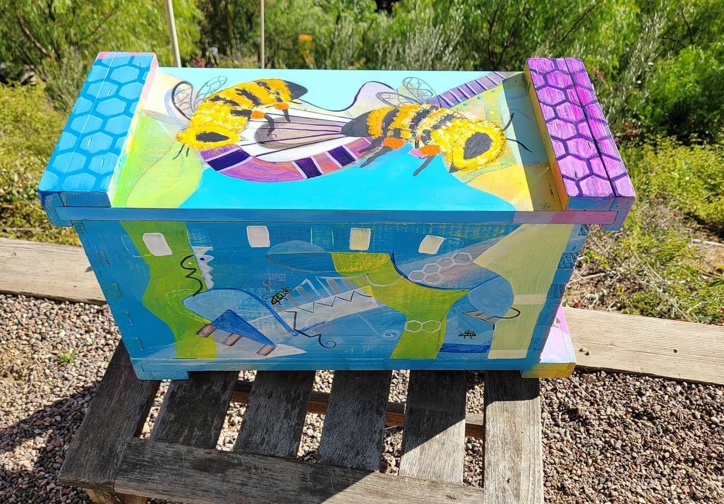 Blue and purple bee box with painted bees